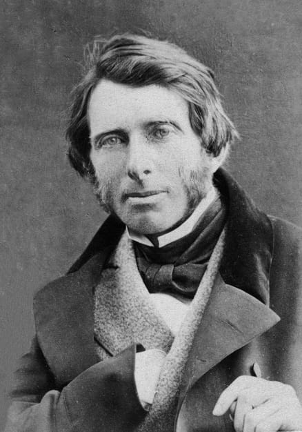 Mid-19th C. photographic portrait of an upper-class man, with bushy sideburns, wearing a winter top coat.
