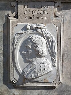 A tomb featuring a bas relief depiction of a man in profile.