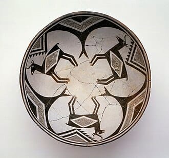 A shallow bowl or plate decorated with images of deer.