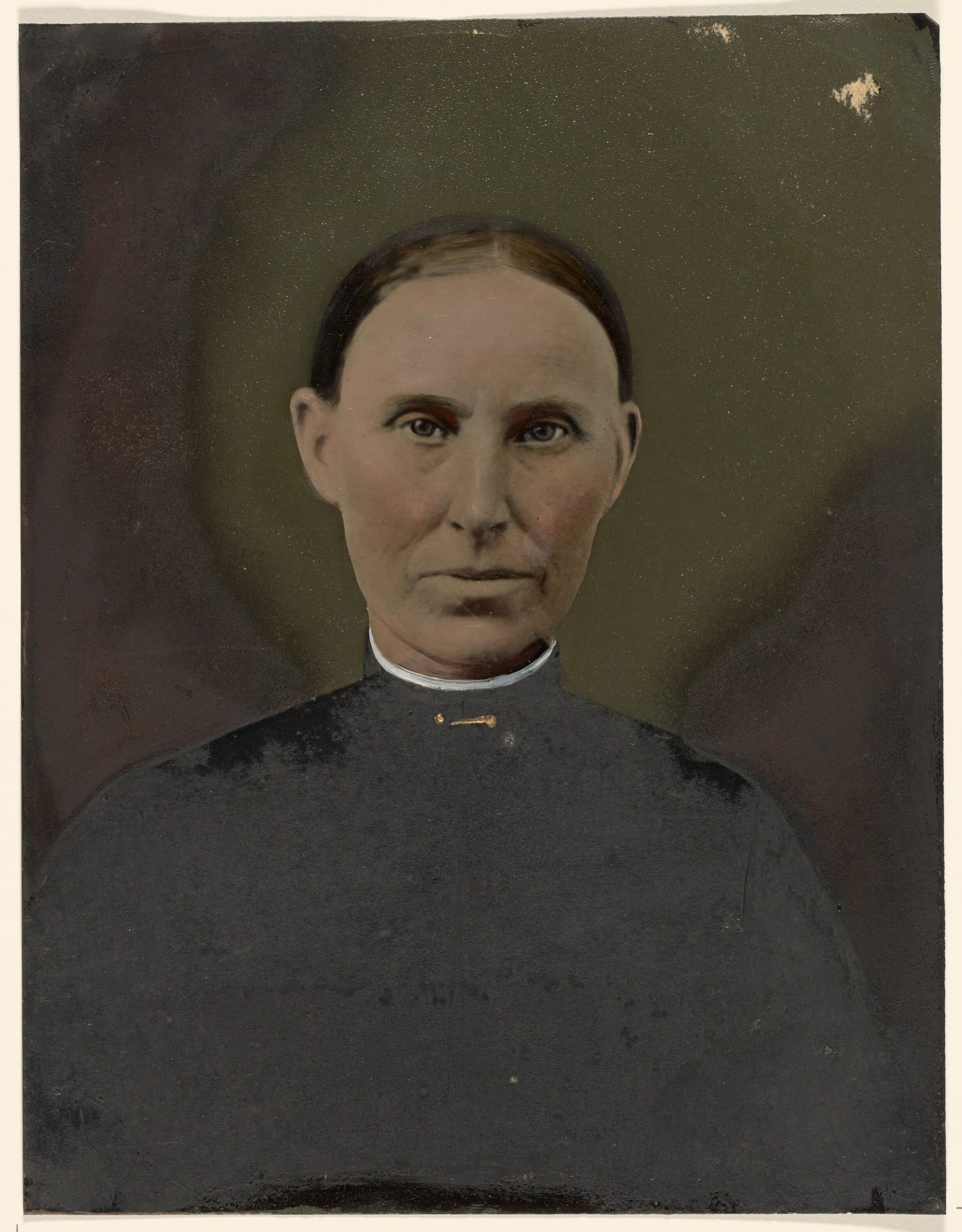 A colourized photogaphic portrait of a late 19th C. middle-aged woman dressed simply in dark clothing against a dark backg