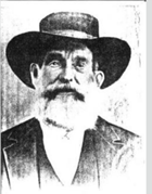 An old photo of a bearded man with a wide-brimmed hat.