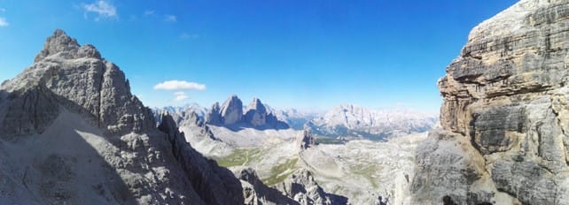 A photo of a distant mountain range, frame between two peaks.